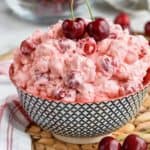 a bowl of cherry cheesecake fruit fluff