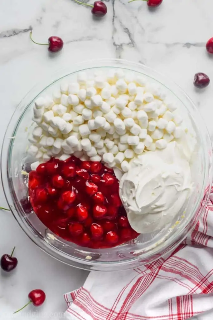 bowl of cherry cheesecake fruit fluff deviled by ingredients