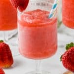 frosted glass of rose with two straws garnished with a strawberry - 7