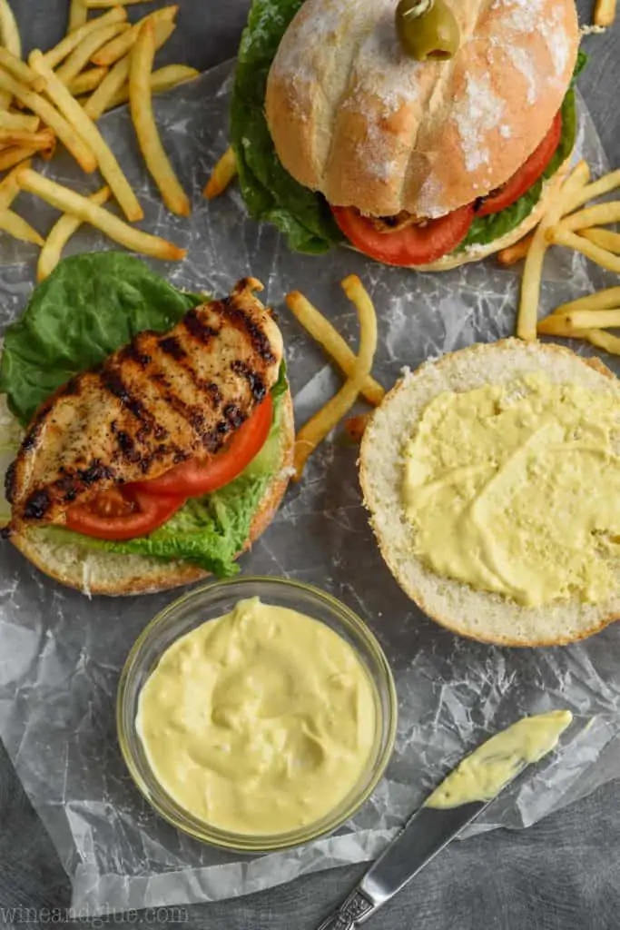 open grilled chicken sandwich with garlic mayo mustard spread