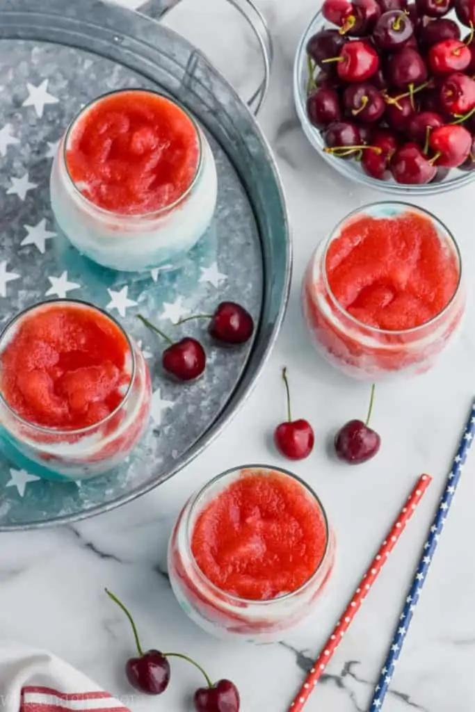 over head view of red, white, and blue wine slushies made in a blender