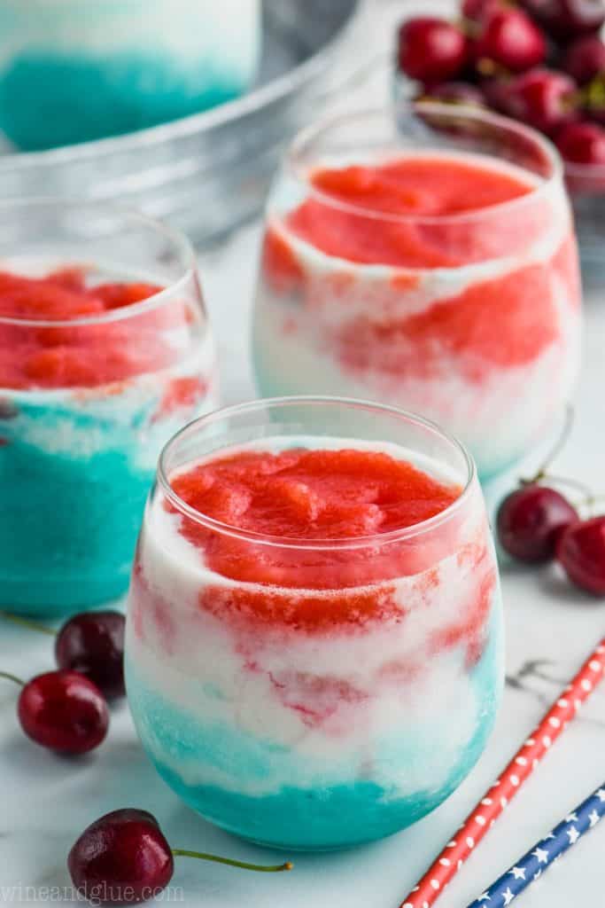 layered wine slushies with red white and blue for fourth of July cocktail (Red, white, and blue on the bottom)