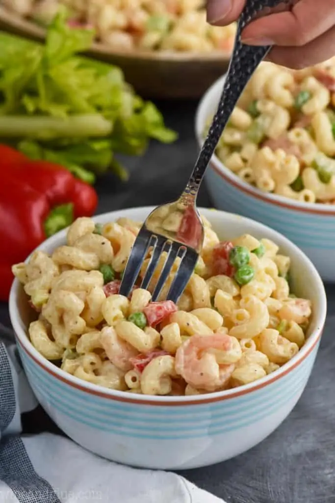 fork in a bowl of the best shrimp pasta salad recipe