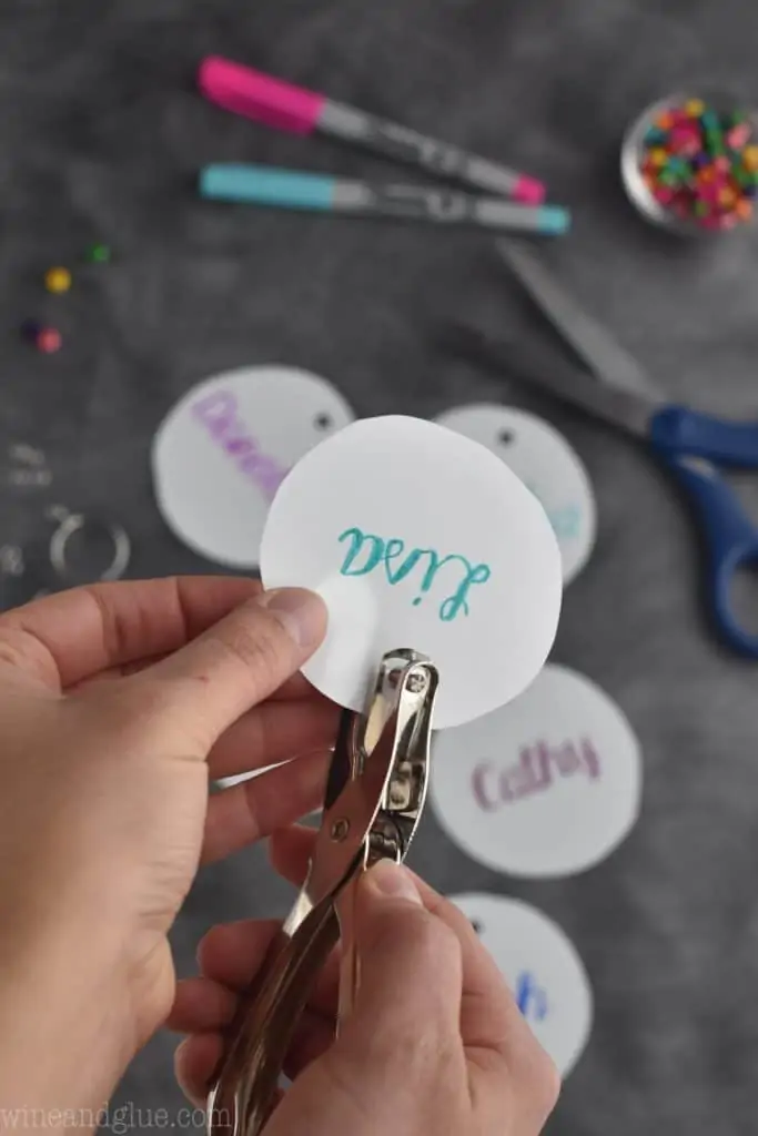 punching a hole in a homemade wine charm