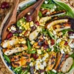 overhead photo of cherry and easy corn salad recipe with grilled chicken and cheese