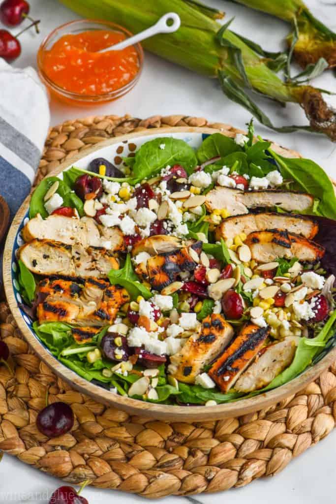 easy corn salad recipe with chicken, cherries, and almonds