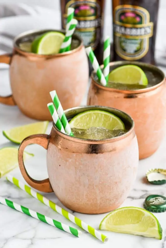 frosted copper mugs holding frozen moscow mules