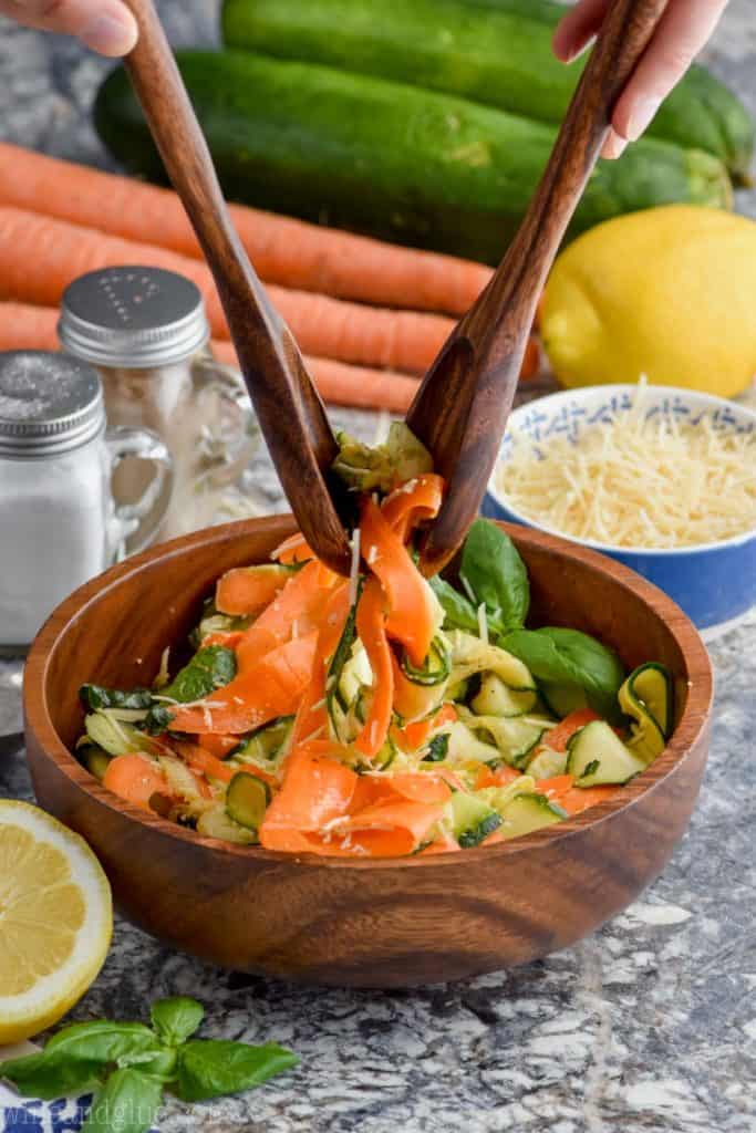 spooning up zucchini noodle salad