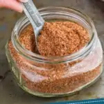 pinterest graphic of a small mason jar holding cajun seasoning