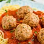 the best turkey meatball recipe on a bed of sauce and spaghetti