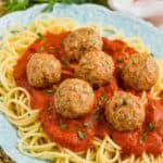 the best turkey meatball recipe on a bed of sauce and spaghetti