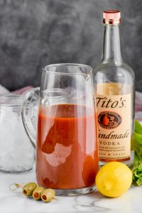 pitcher of the best bloody mary mix with a bottle of vodka