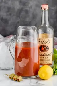 pitcher of the best bloody mary mix with a bottle of vodka