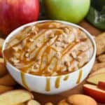 easy caramel apple dip recipe in a bowl with drippy caramel sauce