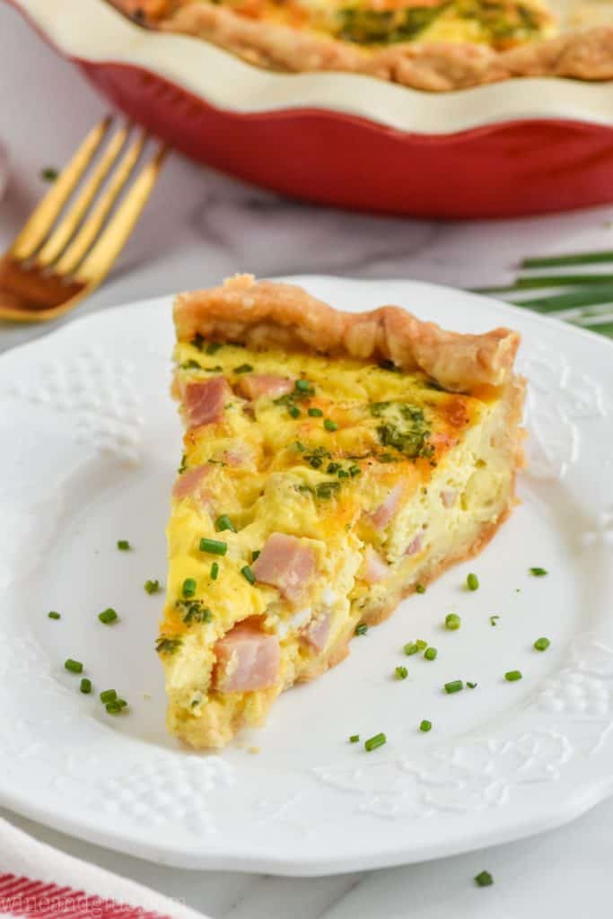 ham and cheese quiche recipe on a plate with chives