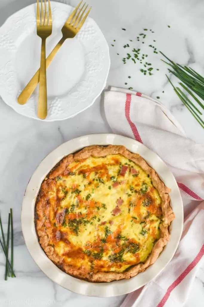 overhead view of ham and cheese quiche that has a beautiful golden crust and browning