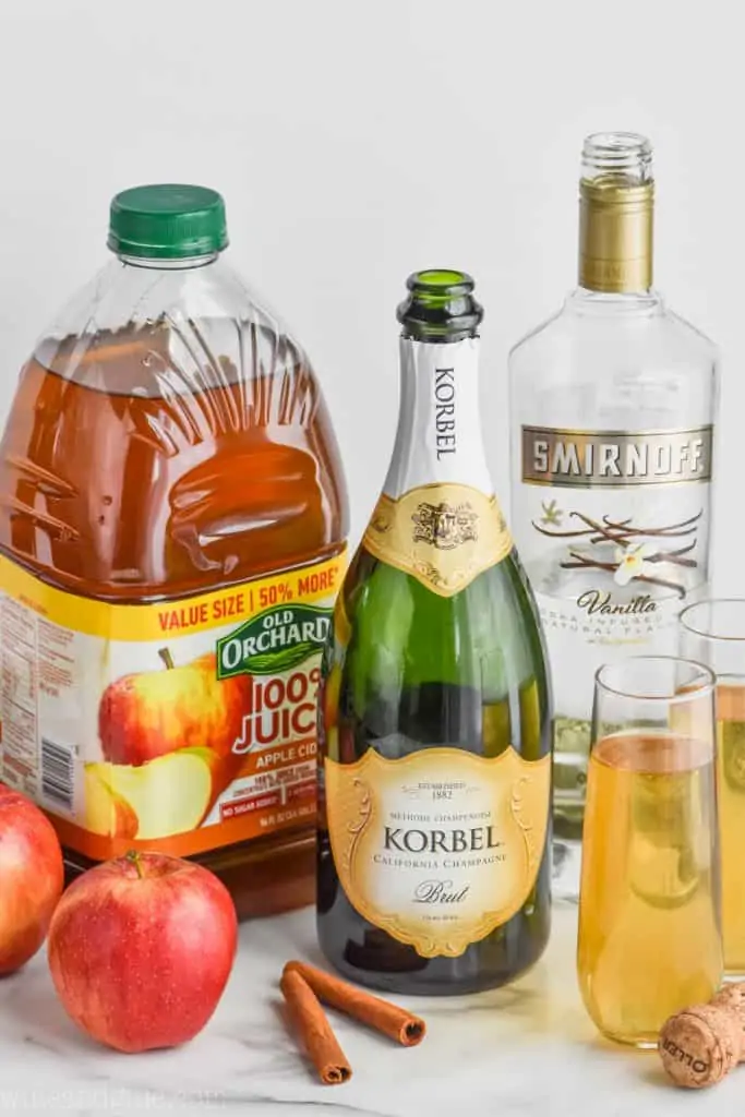 easy apple pie bellini drink recipe ingredients (Apple Juice, Champagne, and Vanilla Smirnoff).