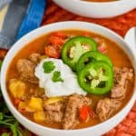 bowl of steak fajita soup recipe topped with sour cream, cilantro, and jalapeños - 7