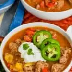 bowl of steak fajita soup recipe topped with sour cream, cilantro, and jalapeños