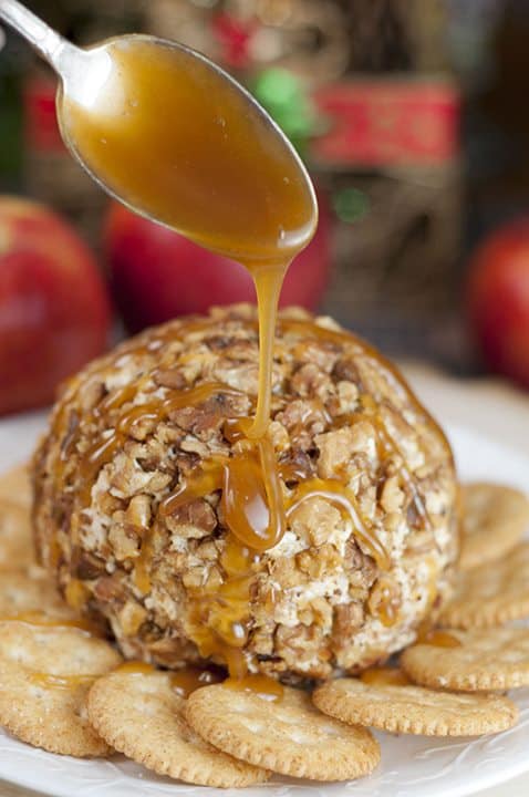 Caramel is poured on top of the Caramel Apple Cheese Ball 