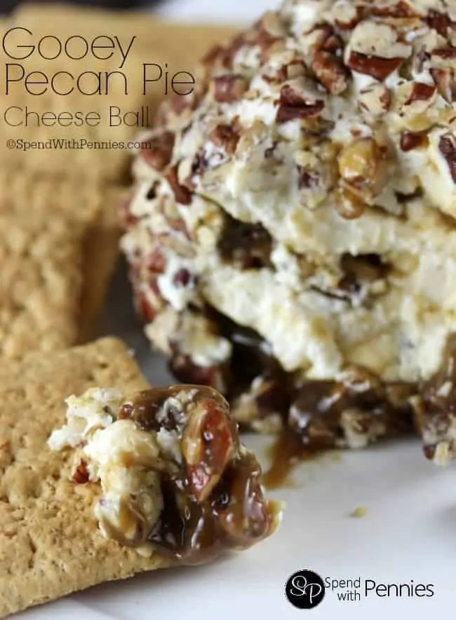 The Gooey Pecan Cheeseball has caramel spewing out and eaten with a graham cracker. 