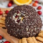chocolate chip coated cranberry orange cheese ball recipe on a cutting board with crackers - 24