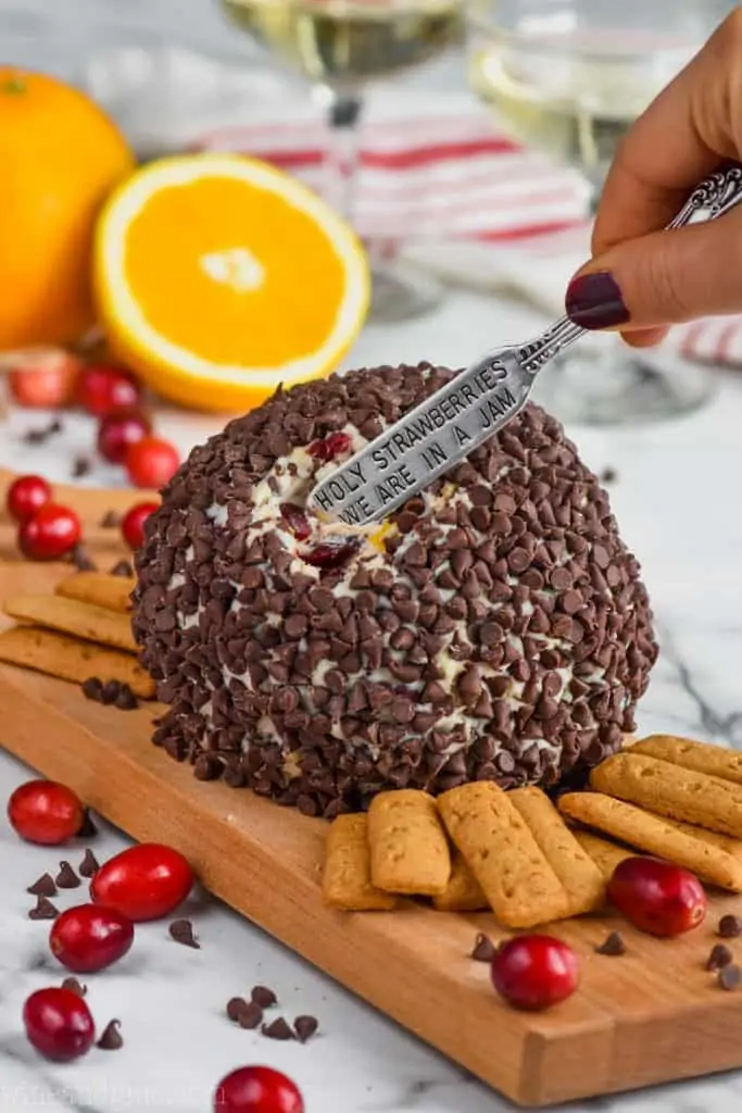 butter knife digging into a dessert cheese ball recipe