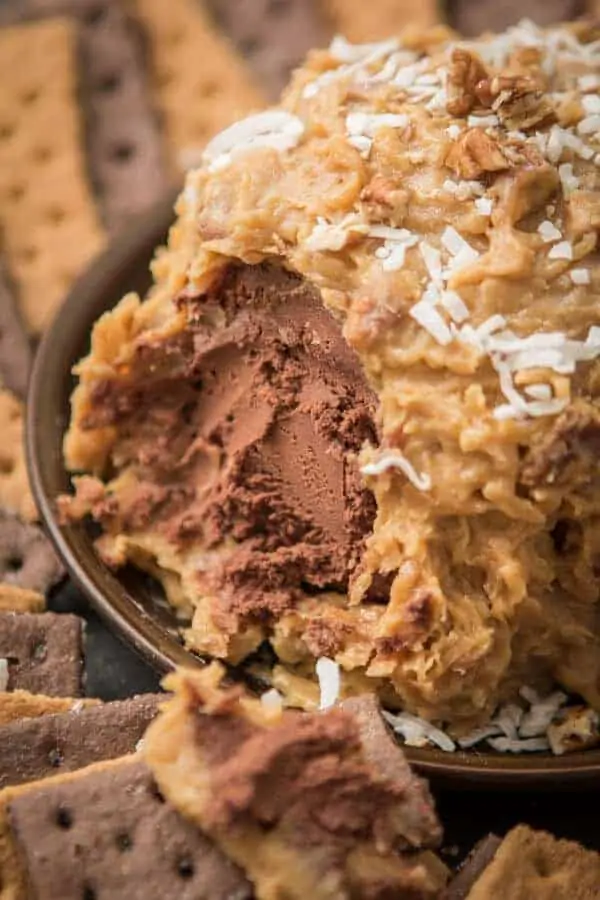 The German Chocolate Cake Cheese Ball has a sticky coconut crust surrounding it. 