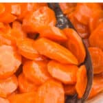 spoon dishing out honey glazed carrots