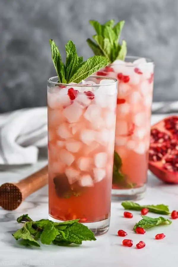 two pomegranate mojitos