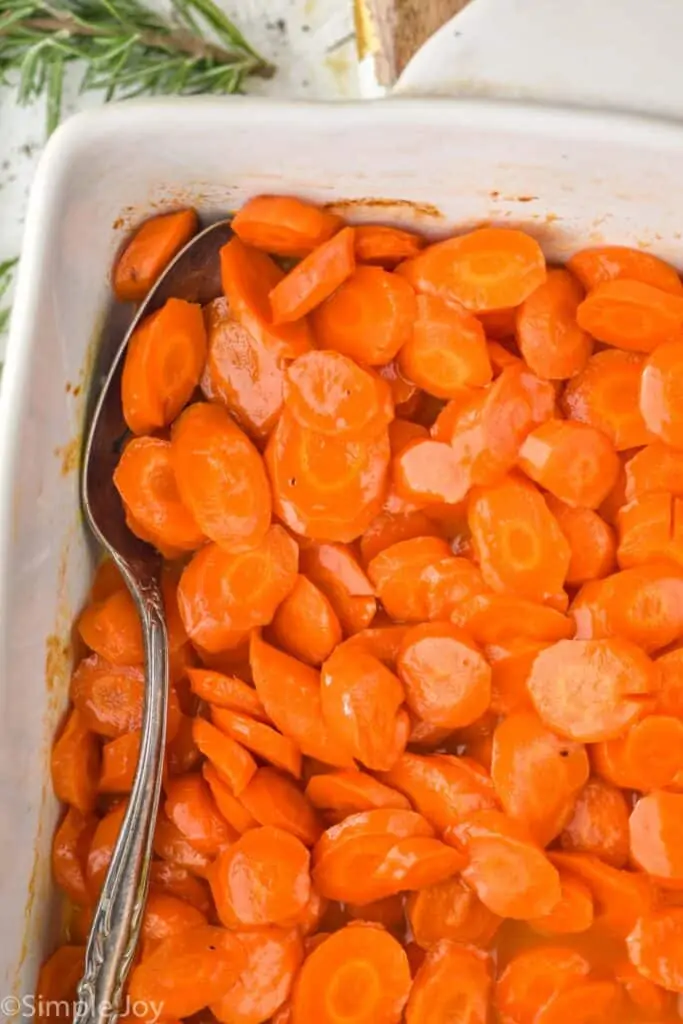 close up overhead photo of baking dish with roasted carrots