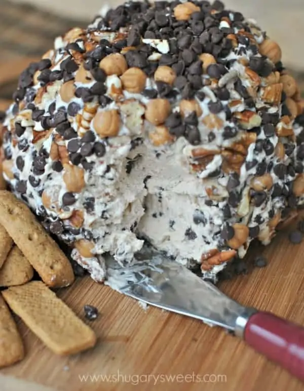 The Turtle Cheeseball is crusted with mini chocolate chips, peanuts, and pecans. 