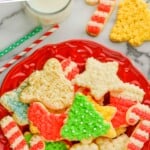 pinterest graphic of a plate of soft sugar cookie recipe, says "the best sugar cookies, simplejoy.com"
