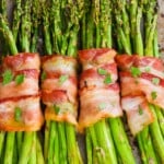 four asparagus bundles, wrapped in bacon after being baked - 10