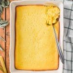 overhead of baked cream corn casserole in white casserole dish - 15