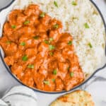 overhead view of a skillet full of butter chicken