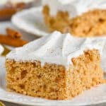 poke cake recipe with cool whip frosting on white plate - 26