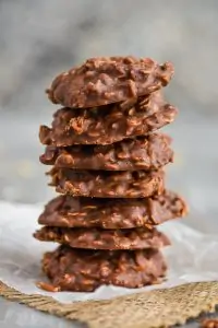 a stack of coconut chocolate peanut butter cookies