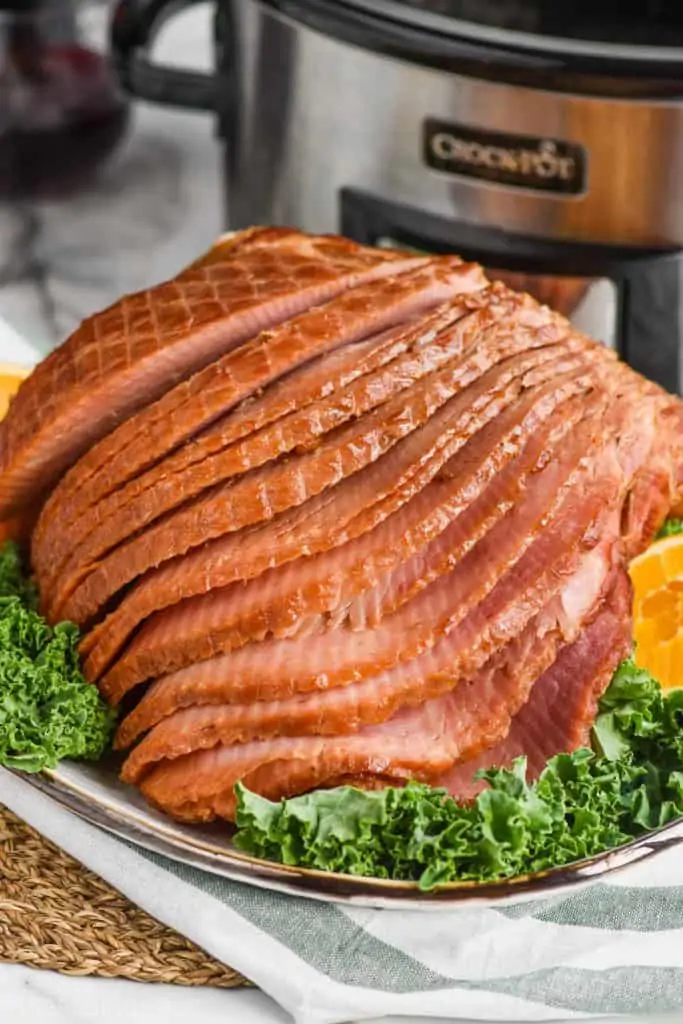 slow cooker ham that has been cooked with a brown sugar glaze