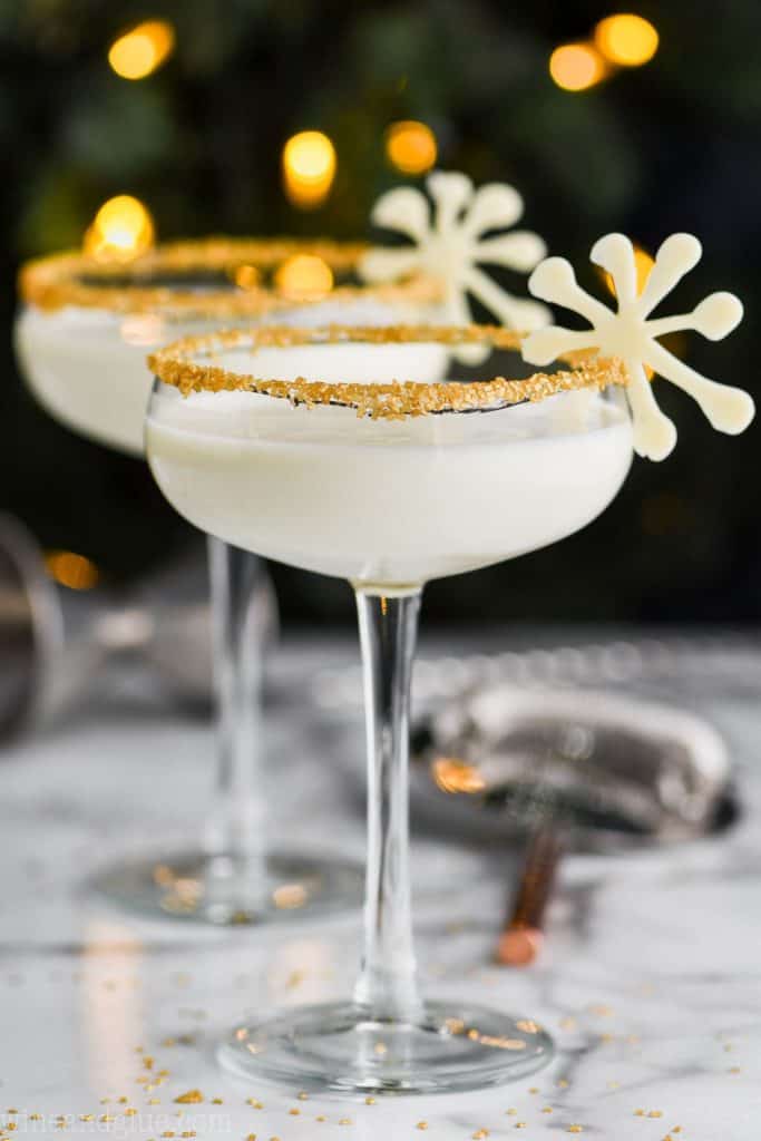 christmas martini in glasses rimmed with gold sugar
