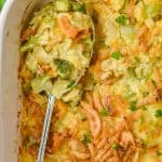 overhead view of a spoon in a casserole dish of broccoli rice casserole - 5