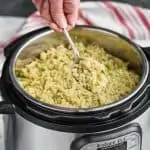 instant pot quinoa being dished out of an instant pot