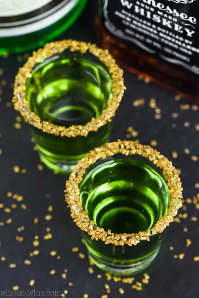 overhead shot of two shot glasses of lucky leprechauns shots