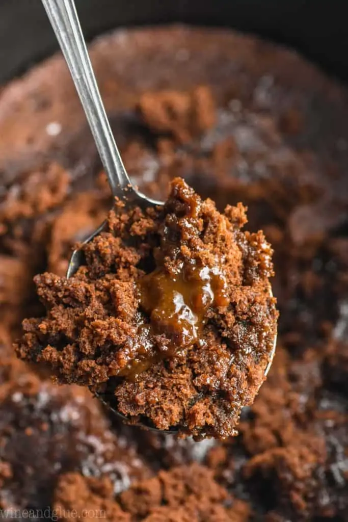 spoonful of crock pot brownies coming out of the slow cooker