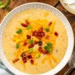 small white bowl full of crockpot potato soup