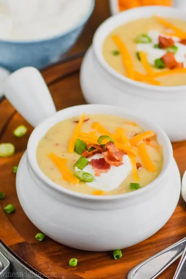 small white bowl full of crockpot potato soup