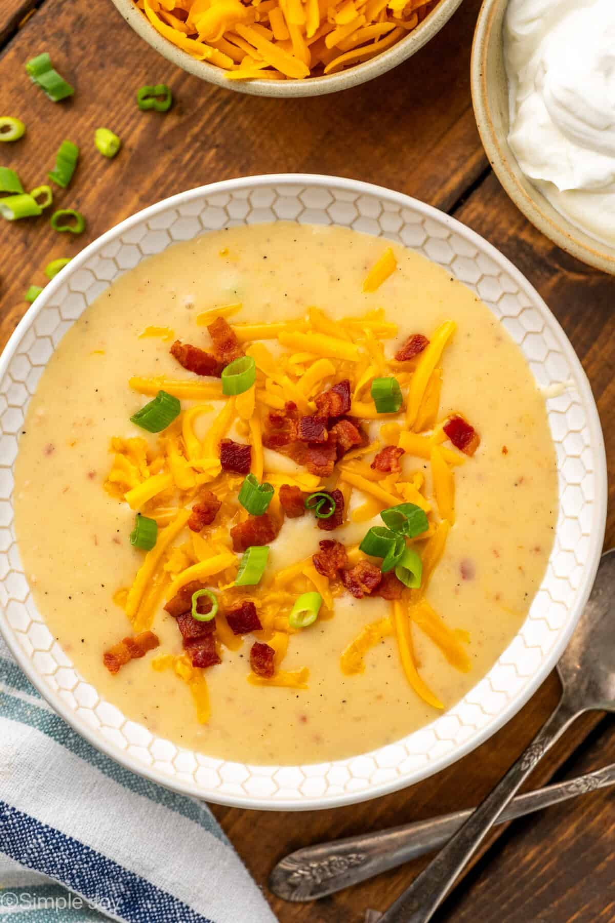 small white bowl full of crockpot potato soup