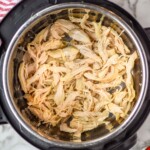 Overhead view of Instant Pot Chicken shredded in an instant pot - 9