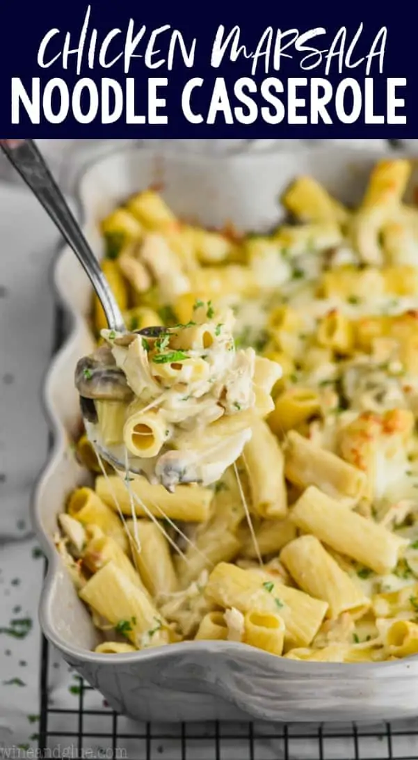 spoon dishing up marsala chicken noodle casserole from a baking dish