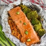 baked teriyaki salmon recipe with broccoli and rice in a foil packet